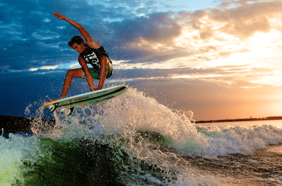 Parker Payne boosting an air during a sunset on Lake Lewisville, photo by Mark Payne